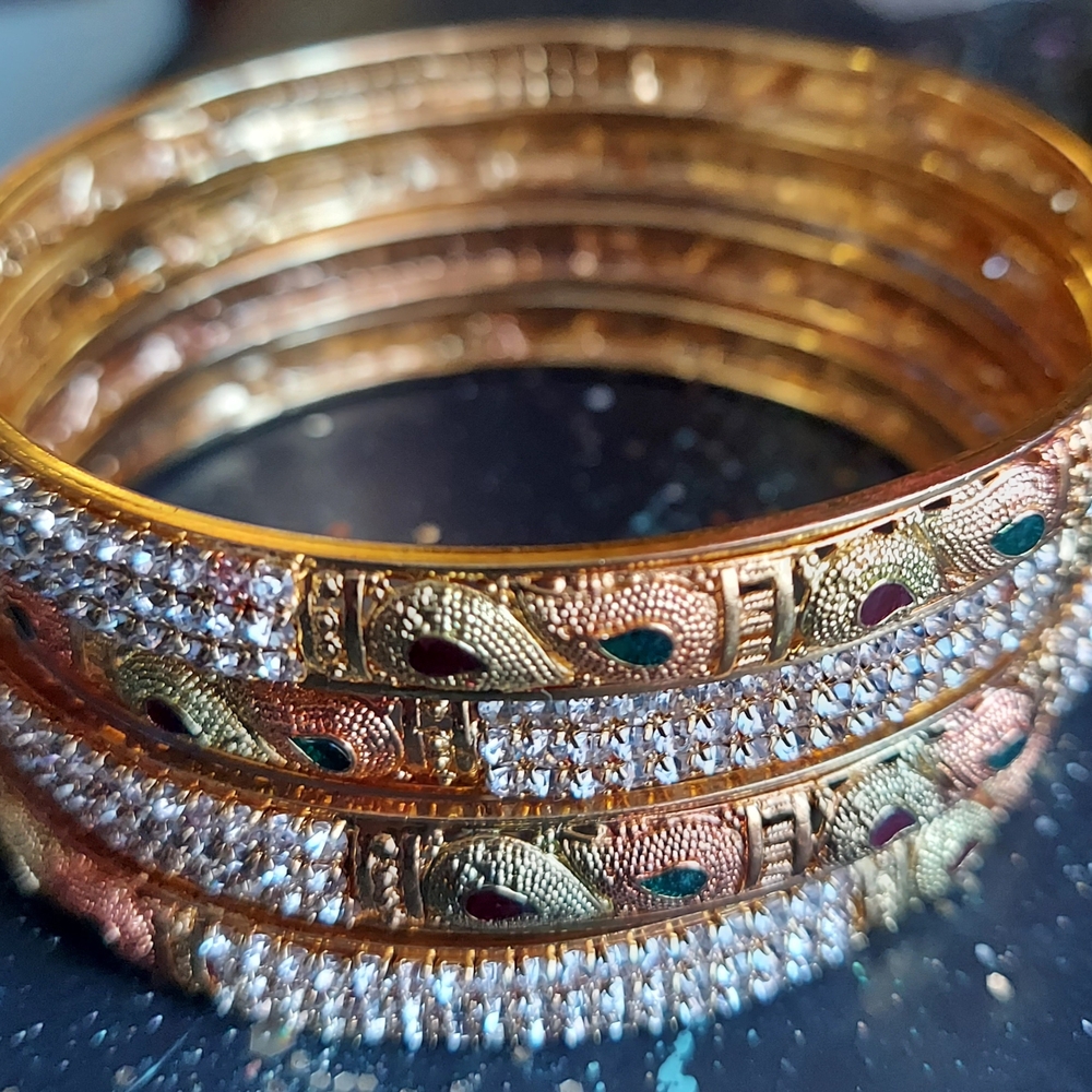 4 Elegant Gold Tone Bangles